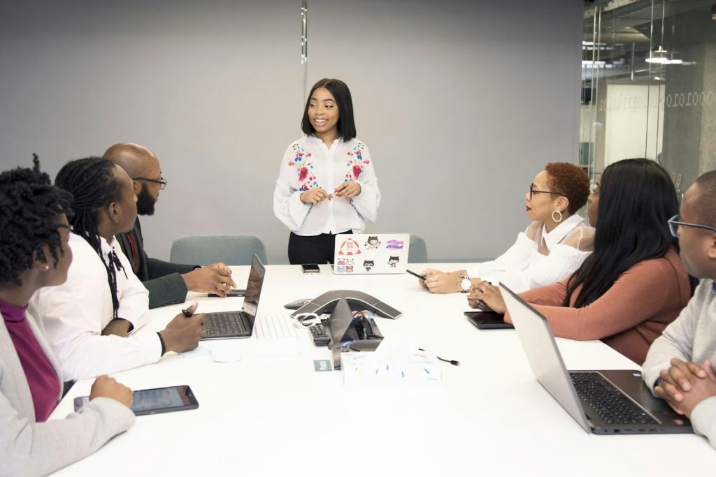 Black professionals participating in a group meeting