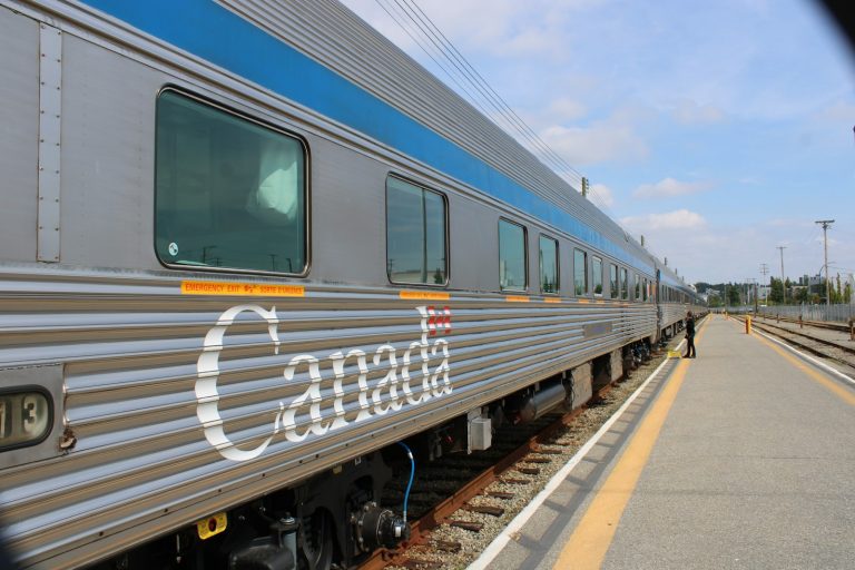 Canadian passenger train at a station — illustrative