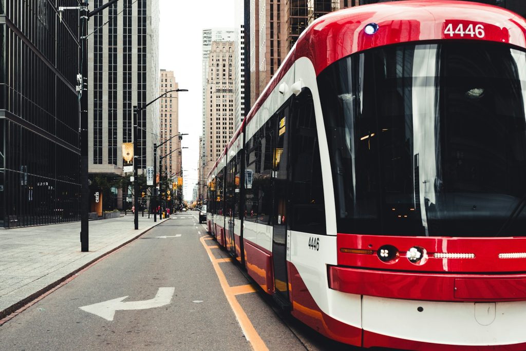 Red and white streetcar stopped on a downtown Toronto street