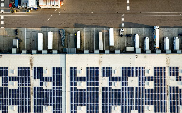 Aerial view of solar panels on a commercial warehouse roof