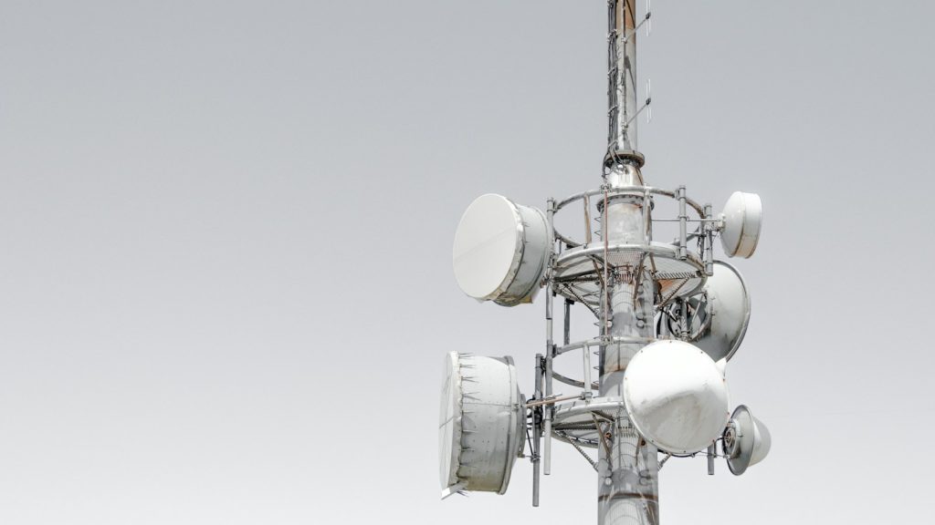 Communications tower against a blue sky