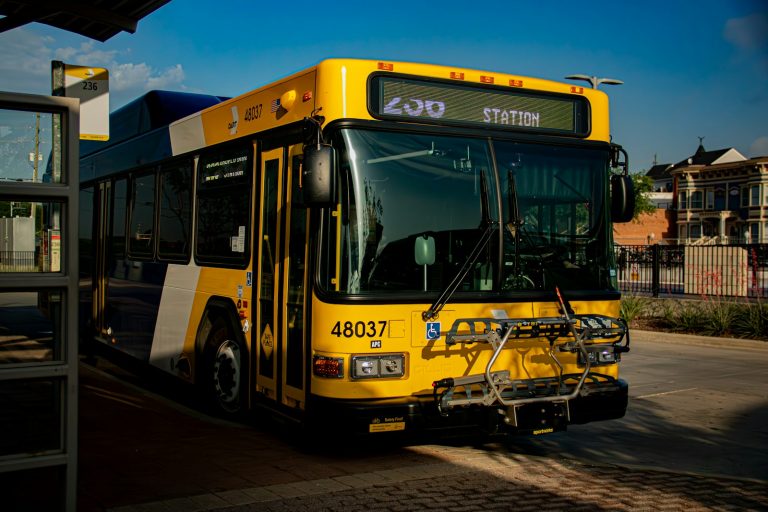 Low-floor public transit bus stopped on a city street, illustrative stock image
