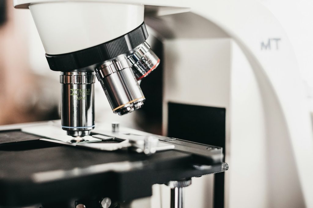 Laboratory microscope with several objective lenses, illustrative stock image