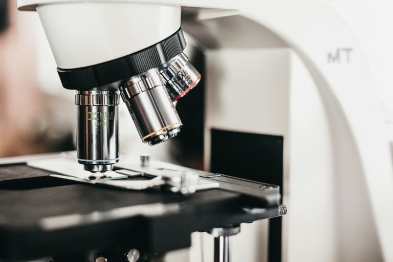 Laboratory microscope with several objective lenses, illustrative stock image