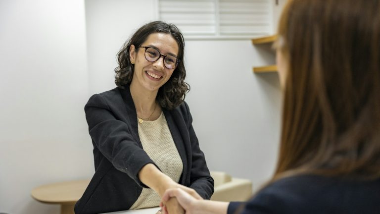 Job candidate shaking hands with a recruiting manager