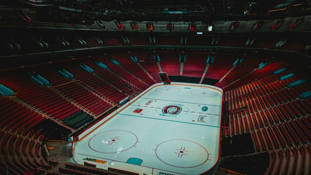 Empty hockey rink and red seating inside Montréal’s Bell Centre