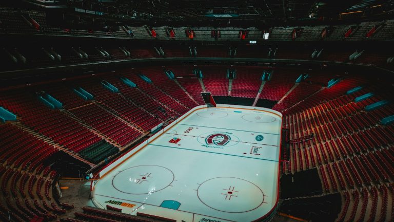 Empty hockey rink and red seating inside Montréal’s Bell Centre