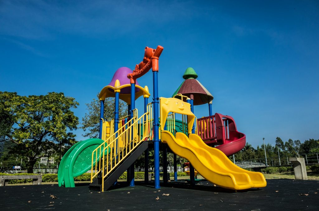 Colourful playground equipment under a blue sky
