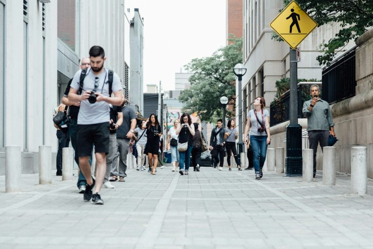 Pedestrians walking along a Toronto city street