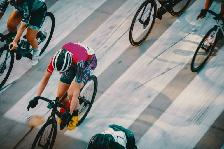 Road cyclists racing at speed, seen from above
