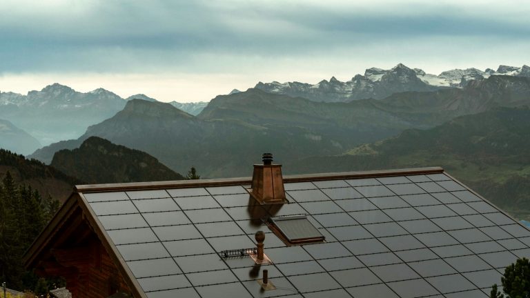 Solar panels covering the roof of a mountain cabin