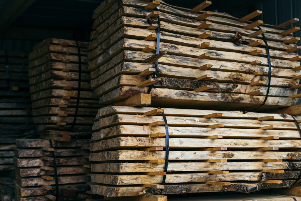 Stacks of cut lumber secured in a timber facility