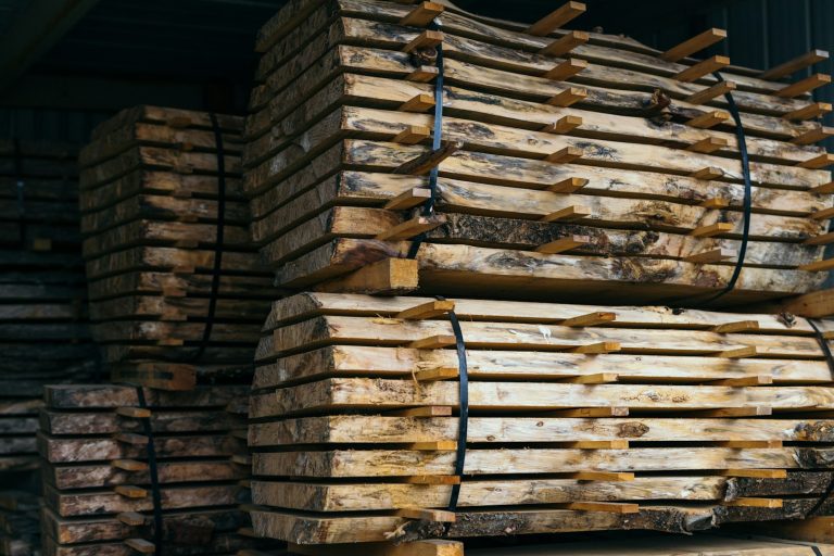 Stacks of cut lumber secured in a timber facility