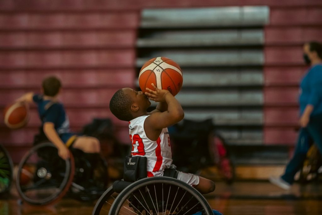 Wheelchair basketball player shooting toward the hoop during a game