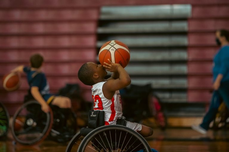 Wheelchair basketball player shooting toward the hoop during a game