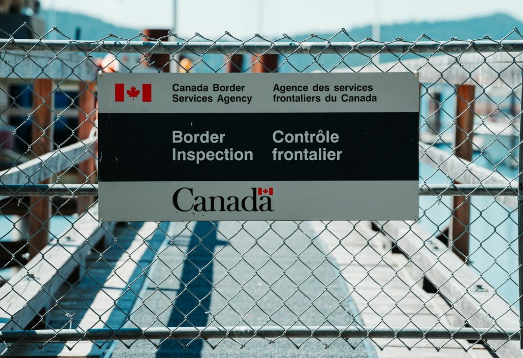 Canada Border Services Agency border-inspection sign on a fence