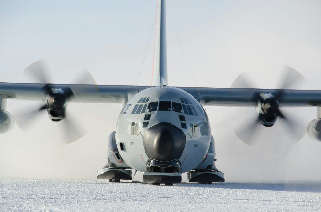 Cargo aircraft parked on a snowy airfield