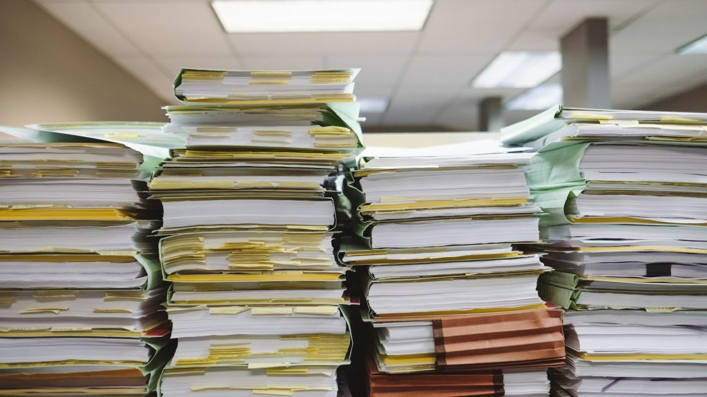 Stacks of paper case files, illustrating independent investigations and oversight