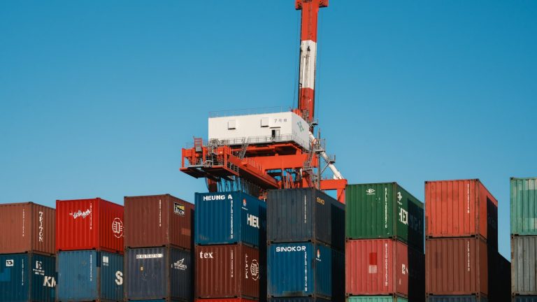 Shipping containers and a cargo crane at a port