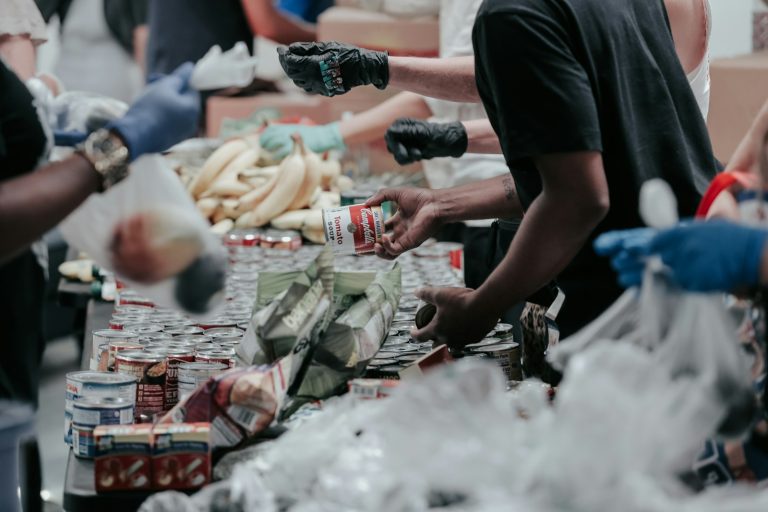 Volunteers sorting donated food supplies, illustrating disaster-response readiness