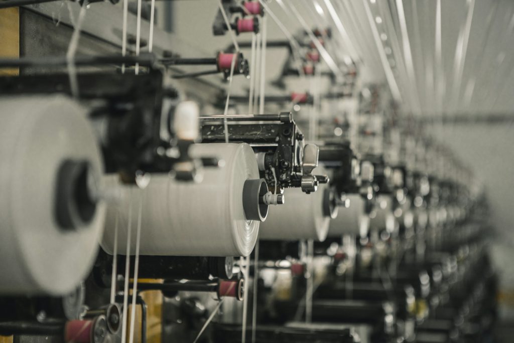Rows of manufacturing machinery inside a factory