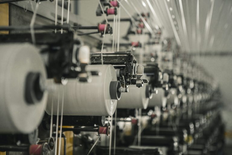 Rows of manufacturing machinery inside a factory