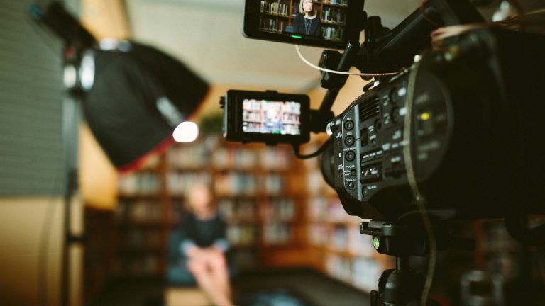 Professional video camera recording an interview