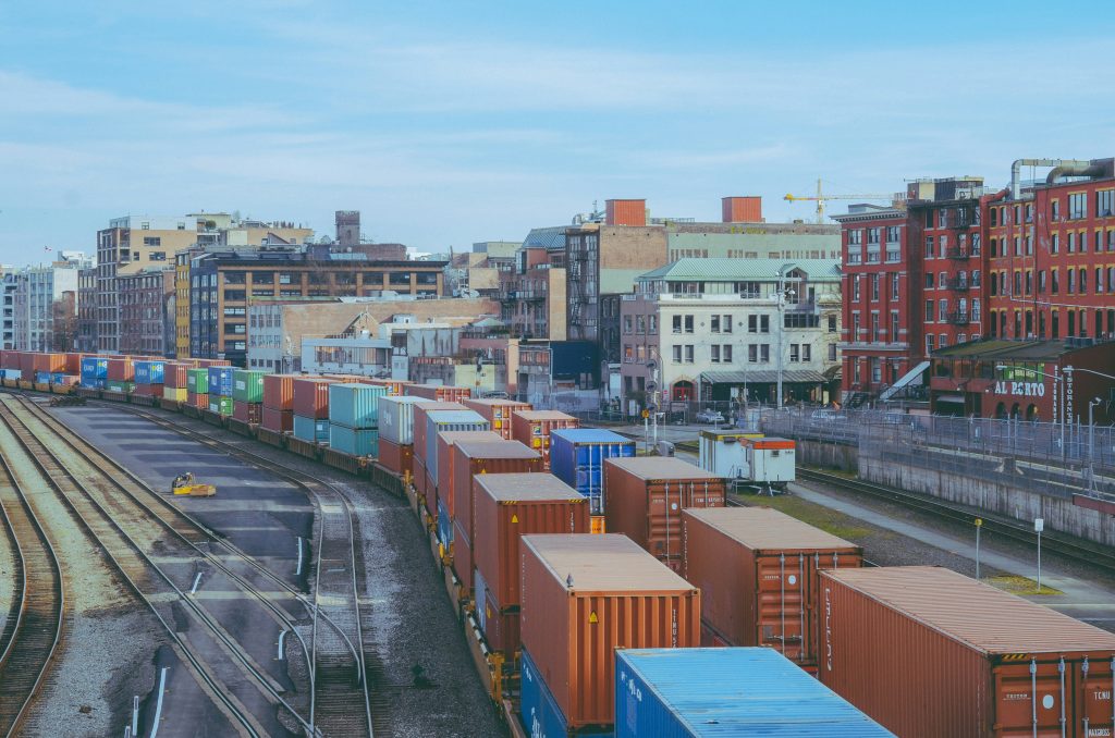 Freight containers arranged in a large rail yard