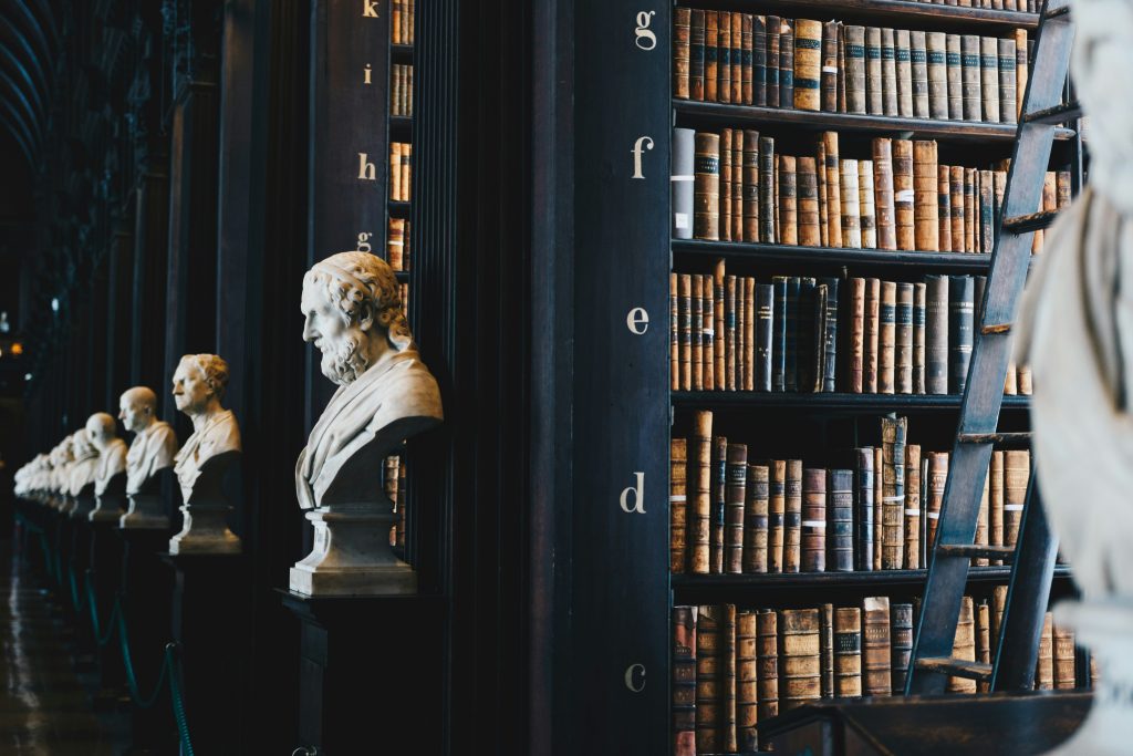 Rows of historical books on library shelves