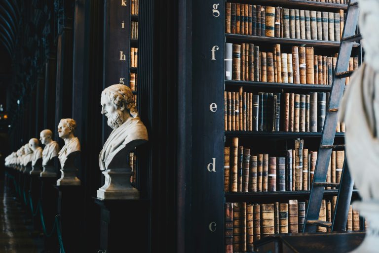 Rows of historical books on library shelves