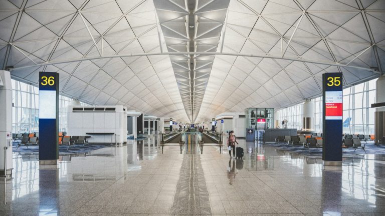 Spacious airport terminal with numbered boarding gates