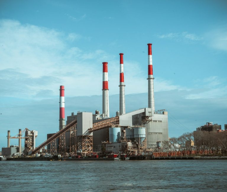Industrial plant building beneath a clear blue sky