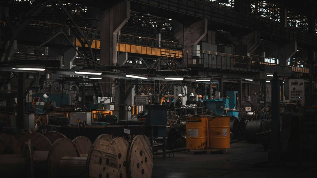 Large industrial factory floor with machinery and workers