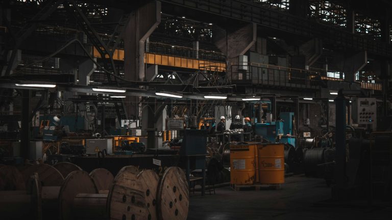 Large industrial factory floor with machinery and workers