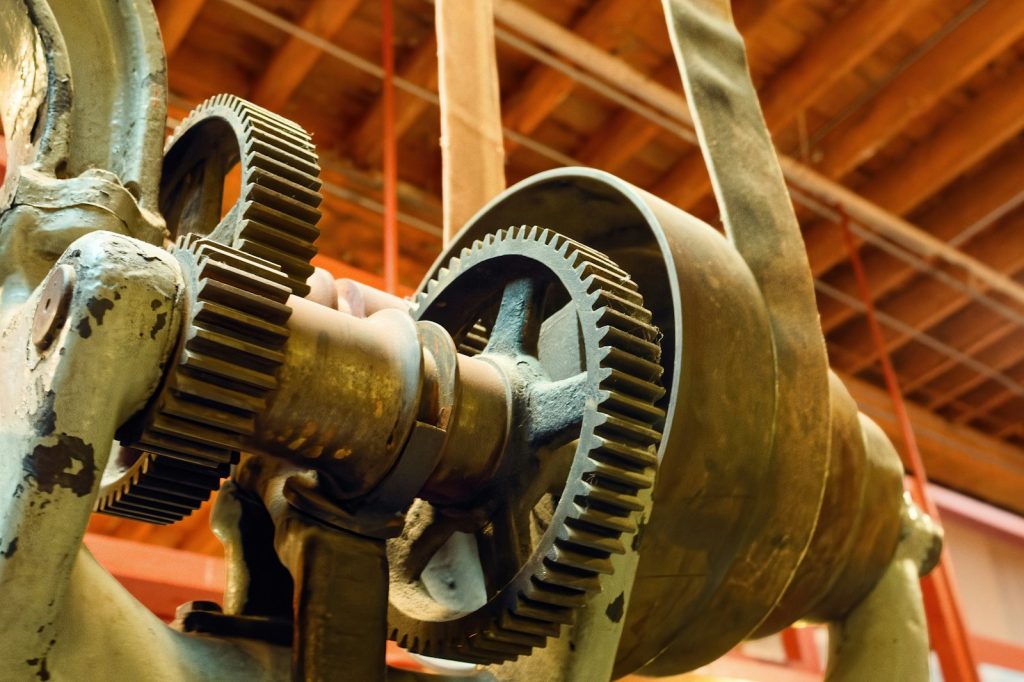 Close view of gears and industrial machinery in a workshop