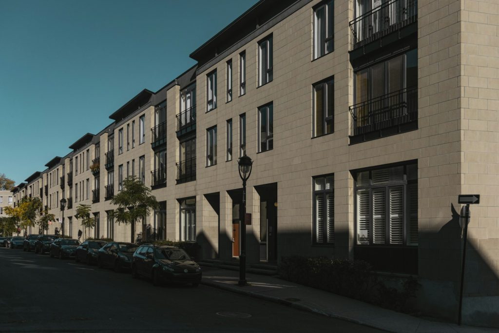Apartment buildings and parked cars on a Montréal residential street