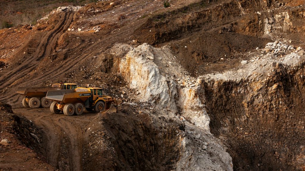 Large haul trucks operating in an open-pit mine