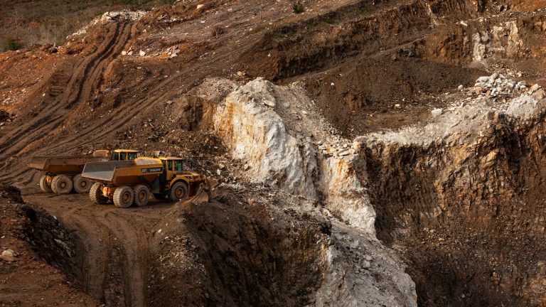 Large haul trucks operating in an open-pit mine
