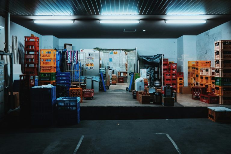Stacked produce crates in a storage and distribution space, illustrative stock image