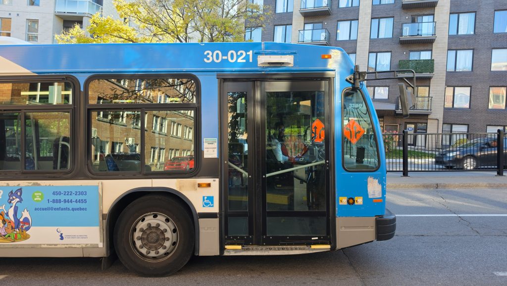 An STM bus on a residential street in Montréal, used to illustrate a construction-related route change