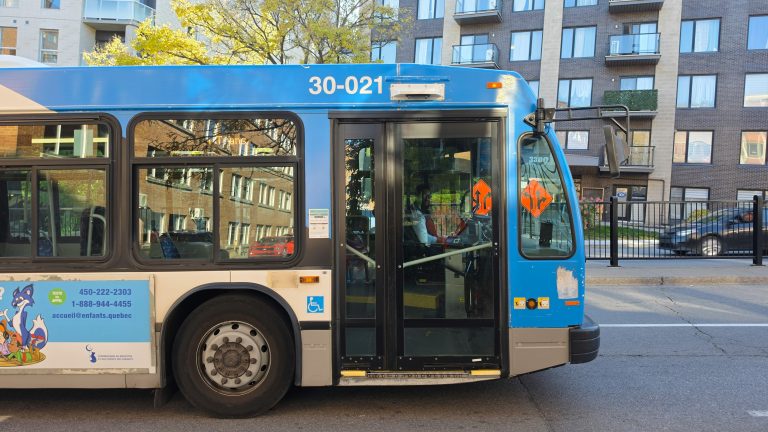 An STM bus on a residential street in Montréal, used to illustrate a construction-related route change