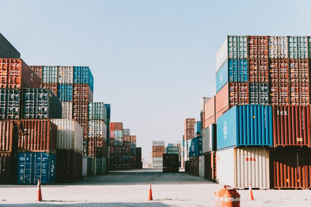 Rows of shipping containers, illustrating international supply-chain rules