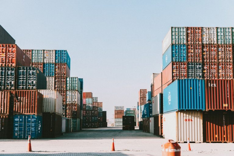 Rows of shipping containers, illustrating international supply-chain rules
