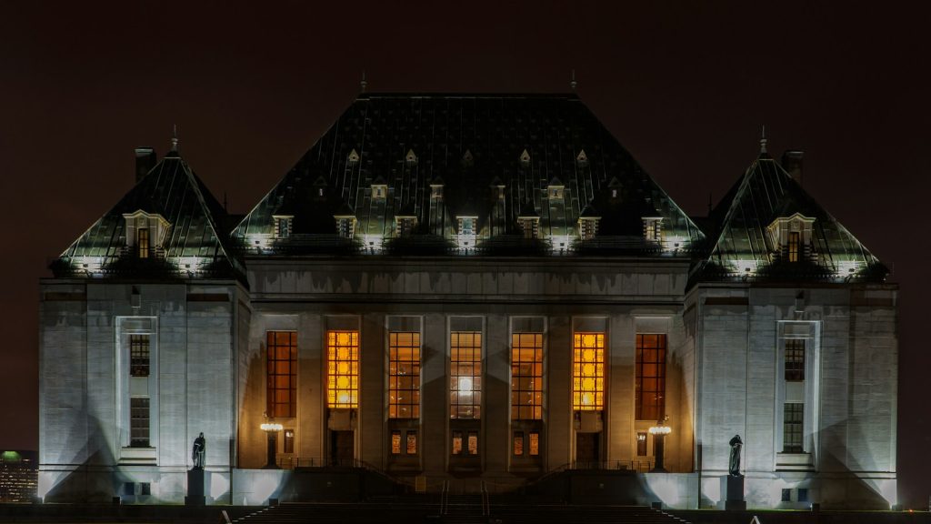 The Supreme Court of Canada building illuminated at night